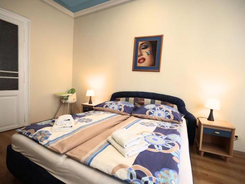a bedroom with a bed with towels on it at Hotel City center one star - Self reception in Košice