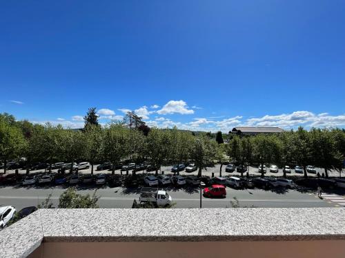 a view of a parking lot with cars parked at The Luxe by Maiden Art in Arona