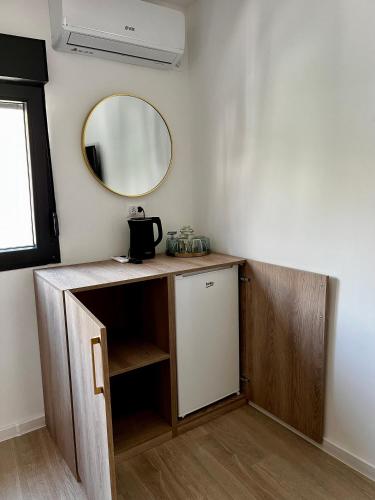 a bathroom with a vanity with a mirror and a sink at Sha Sho in Mostar