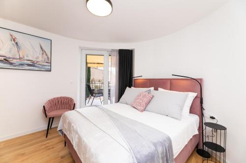 Postel nebo postele na pokoji v ubytování Scaletta Rooms
