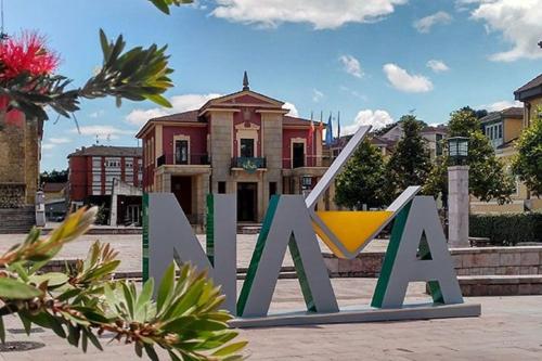 a large sign that says ak in front of a house at Ca la Trini Vivienda Vacacional in Nava