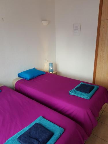 Ένα ή περισσότερα κρεβάτια σε δωμάτιο στο Roberto Guest House "Casa Compartida"