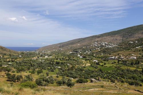 a view of a small town on a hill at Anchorage Andros Villa in Andros