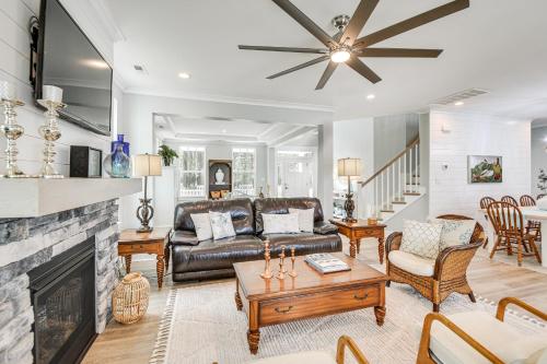 a living room with a couch and a fireplace at Cape Charles Home Private Pier and Beach-Front Deck in Cape Charles