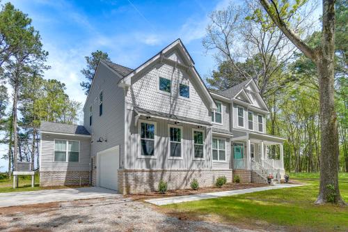 a large white house with a driveway at Cape Charles Home Private Pier and Beach-Front Deck in Cape Charles