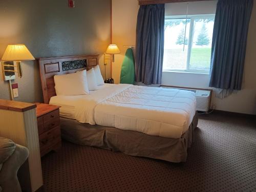 Een bed of bedden in een kamer bij Miriam Hotel
