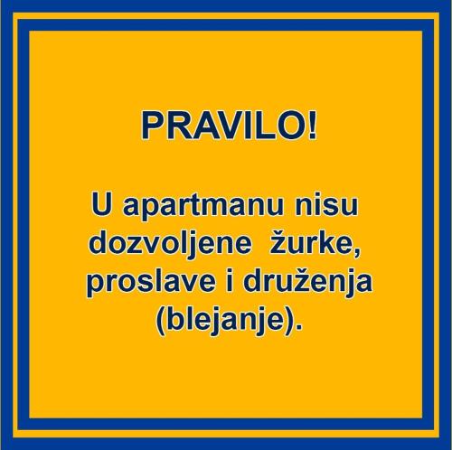 un cartello giallo con le parole "tgivanivanivanholmivanholmivanivan" di Ana Apartment a Novi Sad