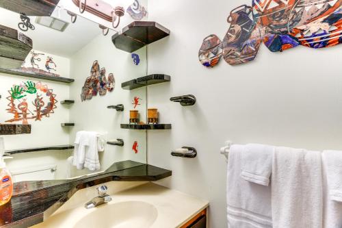 a bathroom with a sink and a mirror at Ski-InandSki-Out Wintergreen Resort Condo and Hot Tub! in Mount Torry Furnace