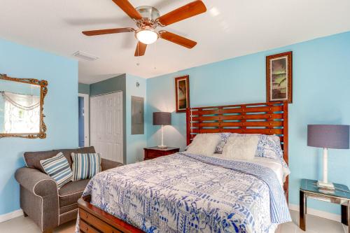 a bedroom with a bed and a couch and a ceiling fan at Pet-Friendly Fort Pierce Home 1 Mi to Downtown! in Fort Pierce