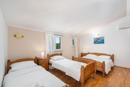Katil atau katil-katil dalam bilik di Laco de Pelagius Rooms