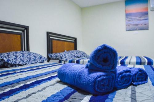 Кровать или кровати в номере Posada Vacacional Brisas del Mar