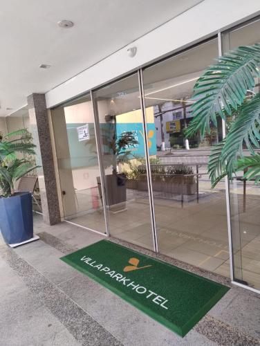 a welcome mat in front of a building at Villa Park Hotel Fortaleza in Fortaleza
