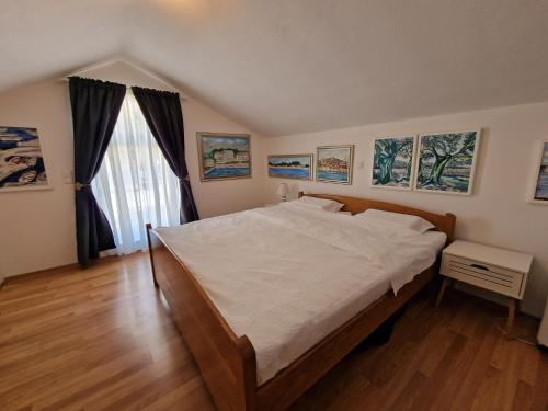 Postel nebo postele na pokoji v ubytování Apartments Podlesek