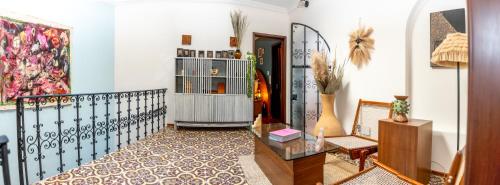a living room with a staircase with a table at Nokal Exclusive Stay in Mexico City