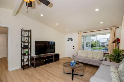 a living room with a couch and a television at Peaceful Family Home with 3 Bedrooms and 2 Bathrooms in Glendora
