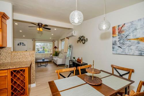 a kitchen and living room with a table and a ceiling fan at Peaceful Family Home with 3 Bedrooms and 2 Bathrooms in Glendora