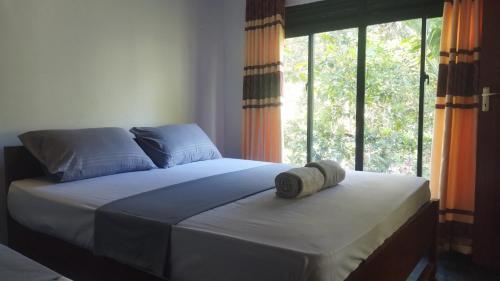 Ένα ή περισσότερα κρεβάτια σε δωμάτιο στο Serendib House - Sinharaja