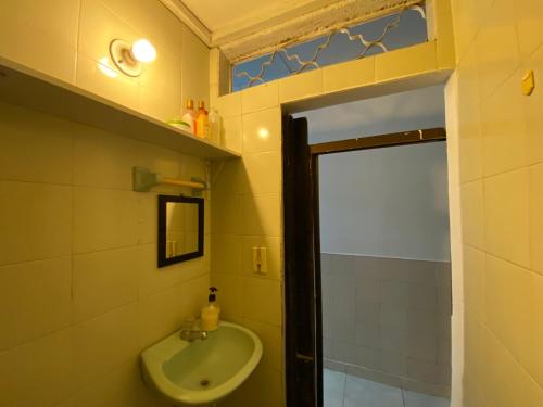 a bathroom with a sink and a toilet in it at Casa Mi Valle Loft in Santa Marta