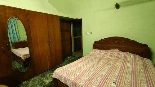 En eller flere senge i et værelse på Ushuaia- Entire villa, nestled in nature's embrace