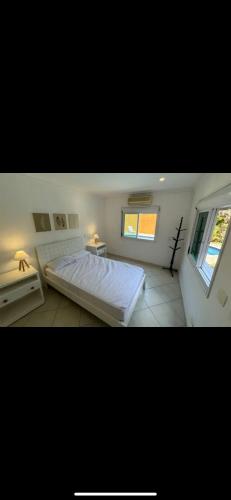 Ein Bett oder Betten in einem Zimmer der Unterkunft Casa com Piscina Pernambuco Churrasqueira
