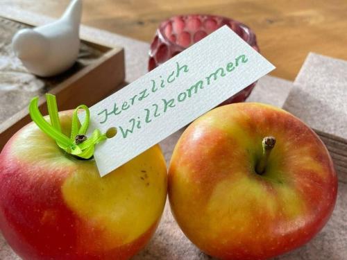 two apples with a sign on top of them at Alpennest Comfortable holiday residence in Füssen