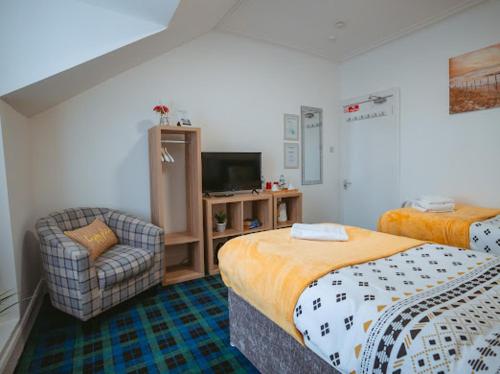 Ένα ή περισσότερα κρεβάτια σε δωμάτιο στο Nairn View Guest House