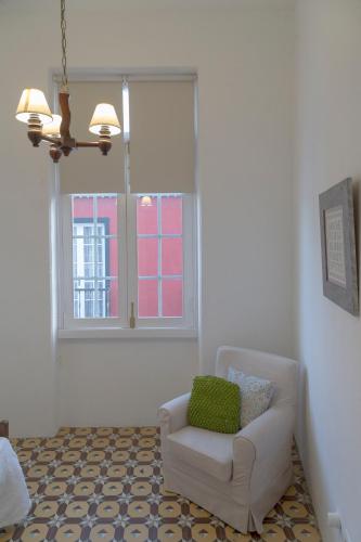 a living room with a chair and a window at Casa Cirila in Santa Cruz de la Palma