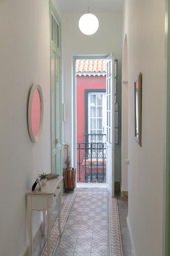 a hallway with a door leading to a balcony at Casa Cirila in Santa Cruz de la Palma