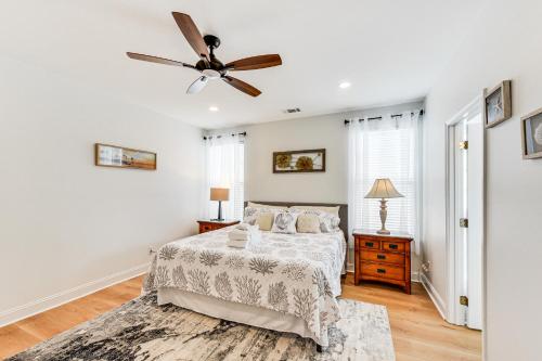 a bedroom with a bed and a ceiling fan at Charming Bluffton Home with Yard about 3 Mi to Beaches! in Bluffton