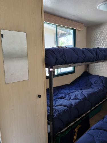 a room with two bunk beds and a window at Chalet La Dolce Vita Viareggio in Viareggio
