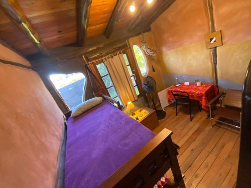 an overhead view of a tiny house with a table at Bed and Breakfast near the Airport in Ezeiza