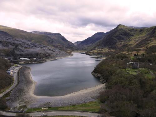 an aerial view of a river in the mountains at Lake view townhouse in Llanberis