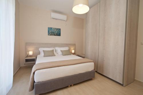 Postel nebo postele na pokoji v ubytování Jasmine Maisonette