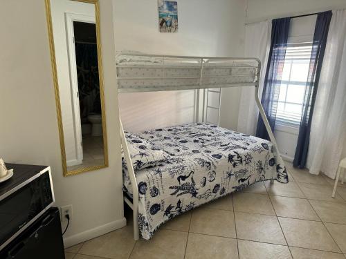 a bunk bed in a room with a mirror at B2 Best Value on Private Bedroom with Private Bathroom in Little Havana, Miami in Miami