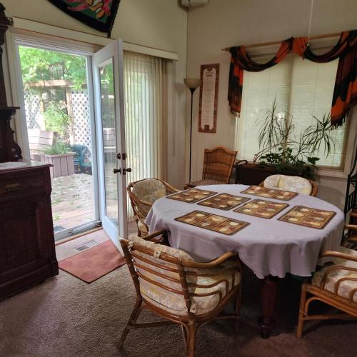 a dining room with a table and chairs and a window at Massanutten Resort Home - Quiet, Convenient, Family- and Pet-Friendly in Massanutten