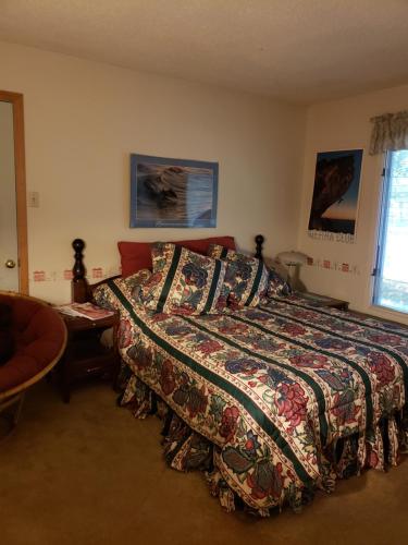 a bedroom with a bed with a quilt on it at Massanutten Resort Home - Quiet, Convenient, Family- and Pet-Friendly in Massanutten
