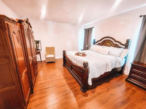 a bedroom with a bed and a wooden floor at Pet Friendly Rancher Brand New on 40 Acres in Leadville