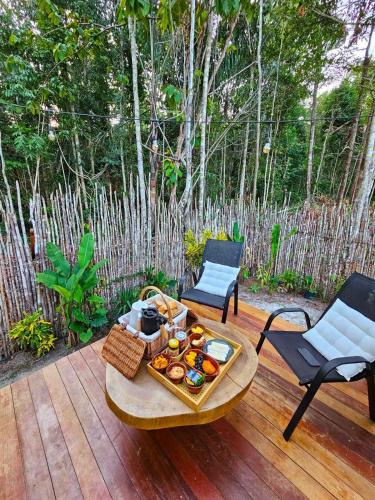 a table with a tray of food on a patio at Cabana Ewaré in Presidente Figueiredo
