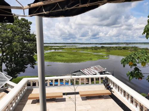 a view of a river from the deck of a house at Casa Trattoria Itaya in Iquitos