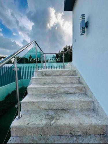 a set of stairs leading up to a building at Luxury Penthouse Santo Domingo W in Santo Domingo