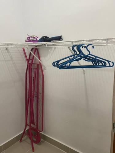 a shelf with hoses on it in a room at Luxury Penthouse Santo Domingo W in Santo Domingo