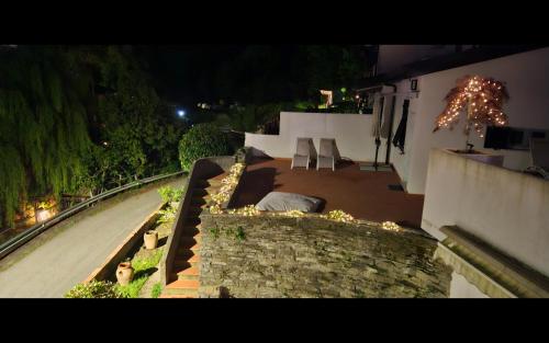 a view of a house at night with a garden at Alveari e Nidi in Ameglia