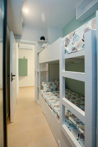 a bunk room with a bunk bed in it at Velipoja Green Home in Velipojë