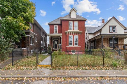 a house with a fence in front of it at 7BR house 19 ppl DT Windsor WD Free Parking in Windsor