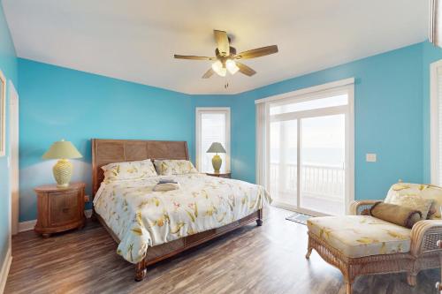 a bedroom with a bed and a ceiling fan at NTB104 Seas Escape in North Topsail Beach