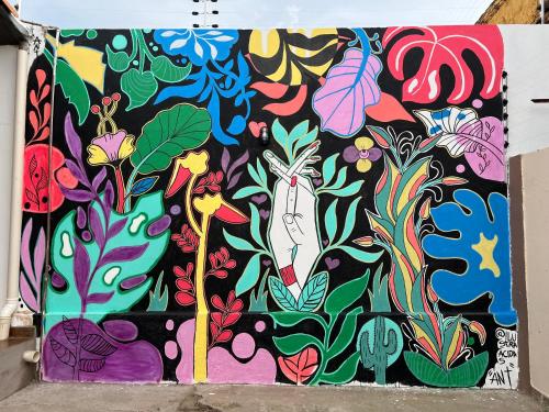 a painting of flowers and plants on a wall at Hotel Ceres 24 - QUARTO COM VENTILADOR in Cuiabá