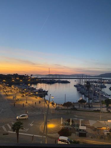 a marina with a lot of boats in the water at Archi di mare - superba vista mare, centralissimo in Alghero