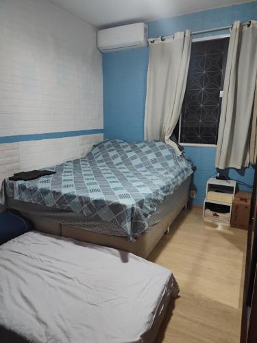 Llit o llits en una habitació de Casa ao Lado Estádio Nilson Santos