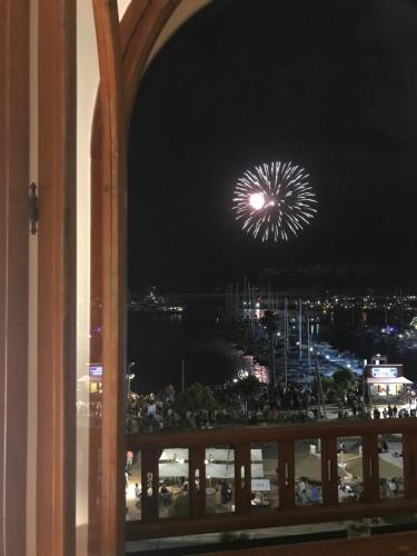 a firework display in the sky at night at Archi di mare - superba vista mare, centralissimo in Alghero