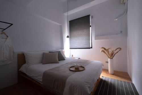 Una cama o camas en una habitación de 台中北歐包棟